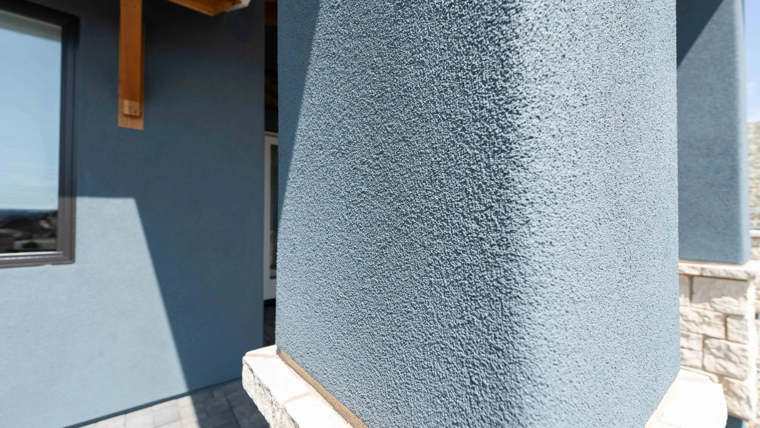 Blue stucco column with lace texture detail