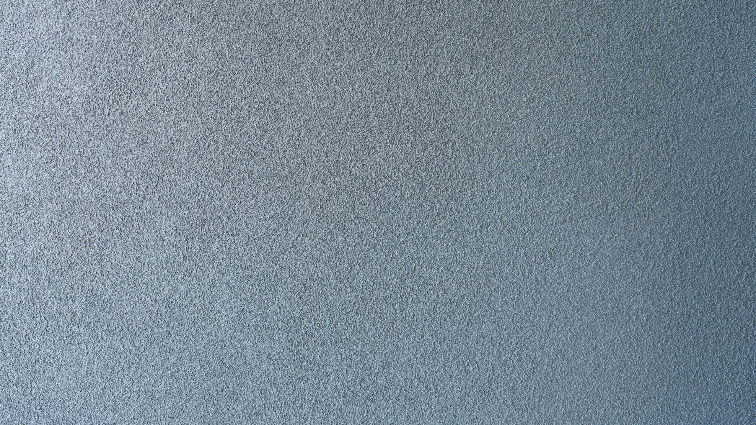 Blue stucco sand finish texture closeup
