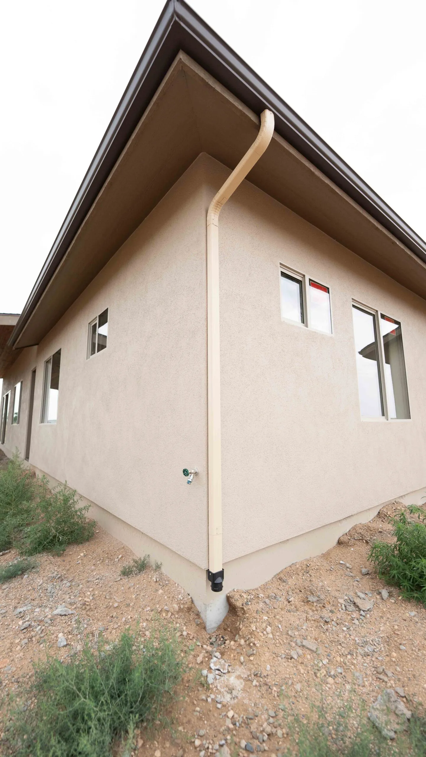 Stucco exterior corner with gutter detail