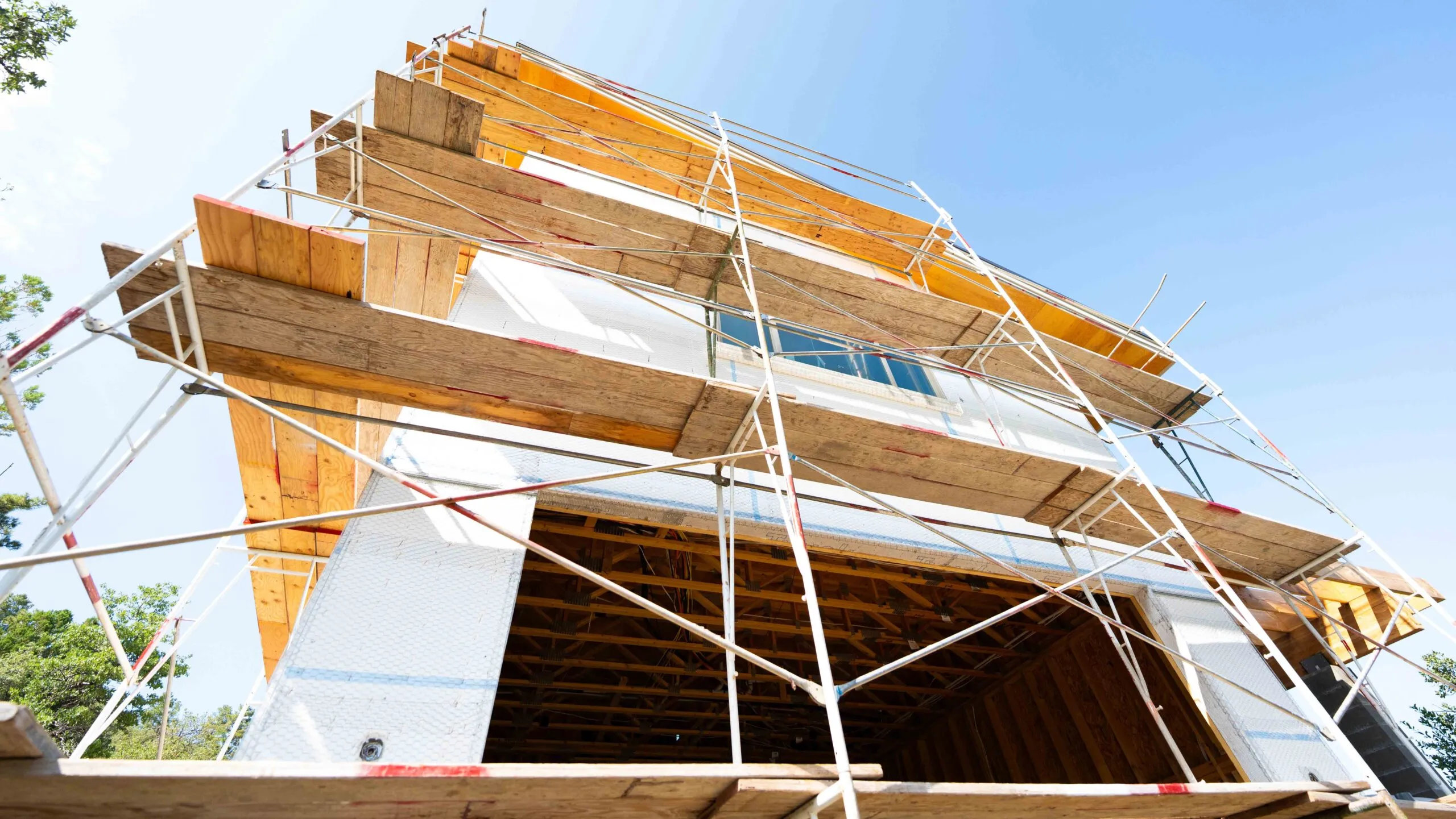 Stucco new construction with scaffolding