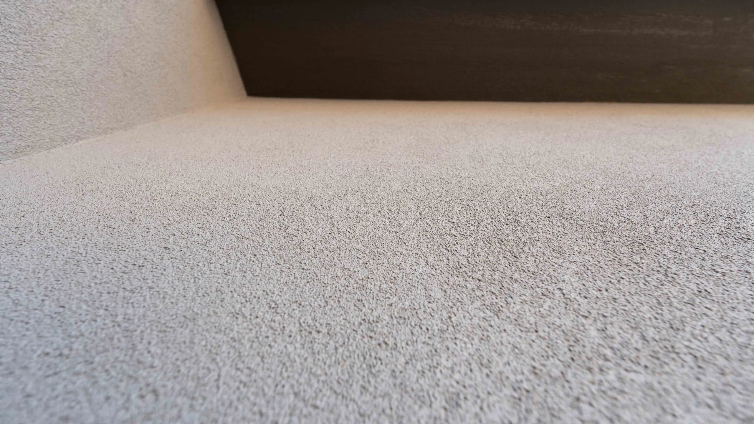 Stucco soffit with sand texture detail