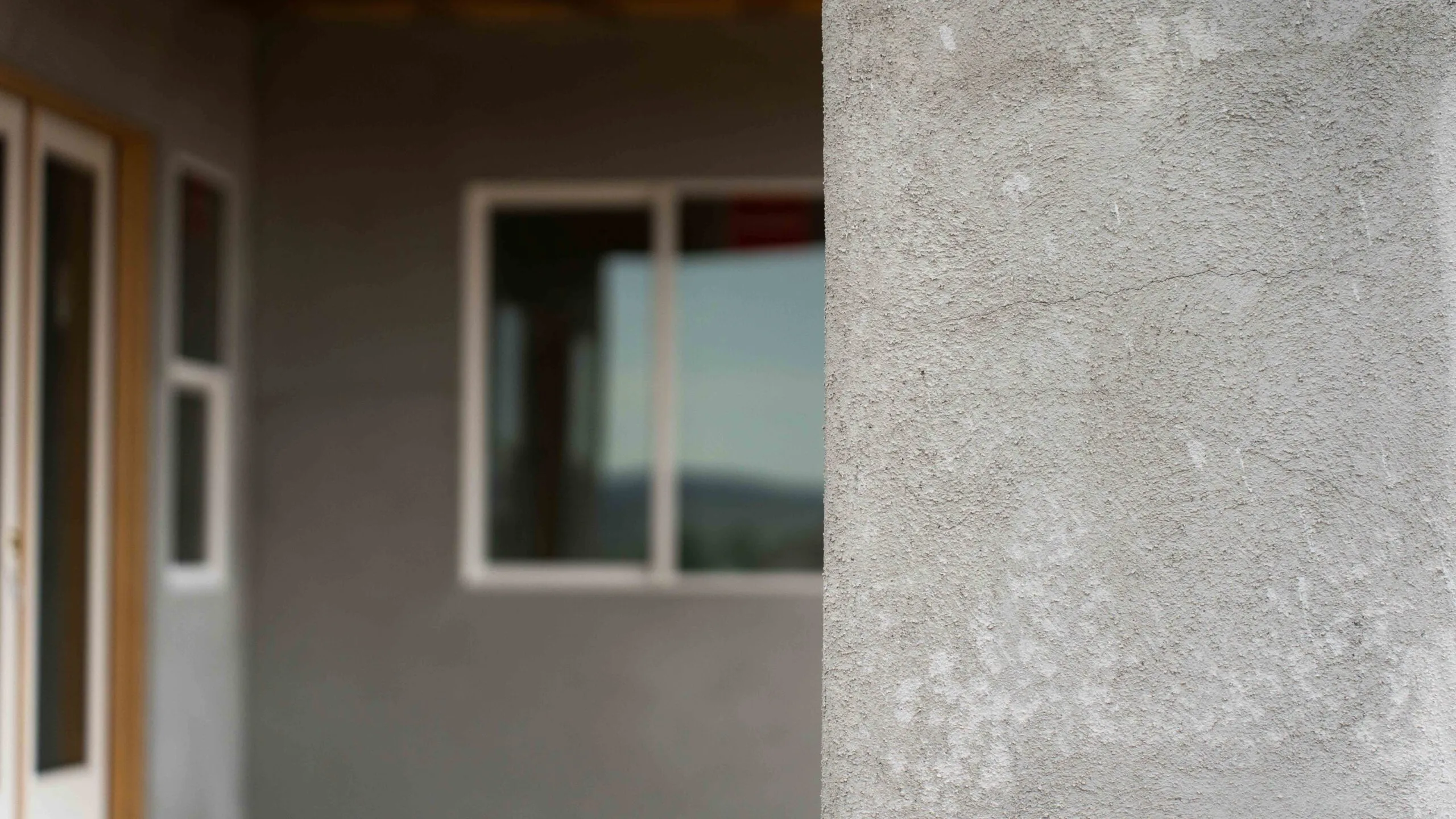 Stucco texture closeup with patio view