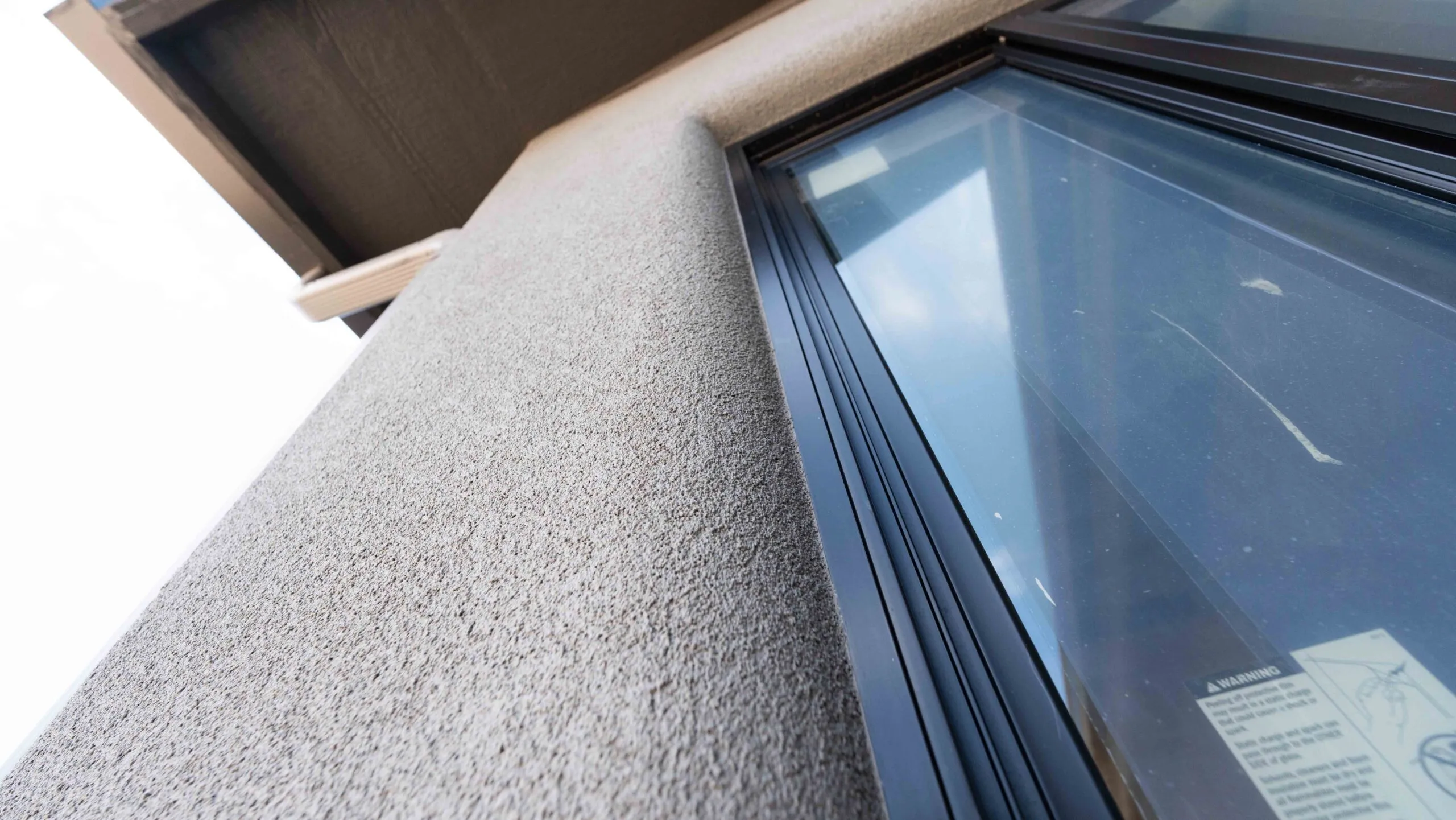 Stucco window trim with lace texture
